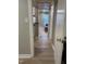 Hallway with hardwood floors, leading to a view of a bright and welcoming living space at 807 W Trinity Ave # 144, Durham, NC 27701