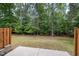 Expansive backyard featuring lush trees and a patio ideal for outdoor gatherings at 809 Amarillo Rose Ln, Durham, NC 27712