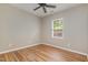 Bedroom featuring a ceiling fan, hardwood floors, and a bright window view at 809 Amarillo Rose Ln, Durham, NC 27712
