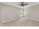 Neutral bedroom featuring a ceiling fan, carpeted flooring, and a window for natural light at 809 Amarillo Rose Ln, Durham, NC 27712