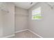 Walk-in closet with built-in shelving and a window for natural light at 809 Amarillo Rose Ln, Durham, NC 27712