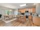 Bright kitchen with modern appliances, granite countertops, and an adjacent dining area at 809 Amarillo Rose Ln, Durham, NC 27712