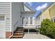 Home with a deck and stairs in the backyard, plus a small patio area at 815 Carpenter Town Ln, Cary, NC 27519