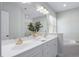 Bathroom features a double sink vanity, large mirror, and a soaking tub for relaxation at 815 Carpenter Town Ln, Cary, NC 27519