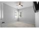 Bright bedroom features neutral walls, carpet, and a ceiling fan for comfortable living at 815 Carpenter Town Ln, Cary, NC 27519
