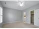 Spacious bedroom features neutral walls, carpet, and an attached bathroom at 815 Carpenter Town Ln, Cary, NC 27519