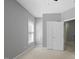 Neutral bedroom featuring a ceiling fan, carpet, closet and window at 815 Carpenter Town Ln, Cary, NC 27519