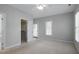 Bright and airy bedroom with a walk-in closet and outside patio access at 815 Carpenter Town Ln, Cary, NC 27519