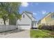 Charming two-story home with a two car garage and deck, set on a well-maintained lot with landscaped yard at 815 Carpenter Town Ln, Cary, NC 27519