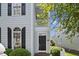 Close-up of the front door of the home, showing the address, sidelight window and porch at 815 Carpenter Town Ln, Cary, NC 27519