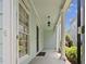 Inviting front porch with classic columns and ample space for outdoor relaxation at 815 Carpenter Town Ln, Cary, NC 27519