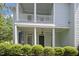 Inviting front porch with classic columns and ample space for outdoor relaxation at 815 Carpenter Town Ln, Cary, NC 27519