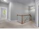 Bright hallway with a staircase and natural light, creating an inviting atmosphere at 815 Carpenter Town Ln, Cary, NC 27519