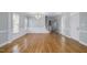 Expansive living room with hardwood floors, elegant wainscotting and natural light from large windows at 815 Carpenter Town Ln, Cary, NC 27519