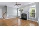 Bright living room featuring hardwood floors, fireplace, and large windows at 815 Carpenter Town Ln, Cary, NC 27519