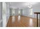 Large living room with beautiful hardwood floors, large windows and elegant trim at 815 Carpenter Town Ln, Cary, NC 27519
