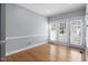 Bright room features wood floors and French doors leading to an outdoor space at 815 Carpenter Town Ln, Cary, NC 27519