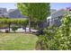 Well-maintained backyard with lush green grass, a black iron fence, and attractive landscaping features at 92 Cardinal Ridge Rd, Chapel Hill, NC 27516