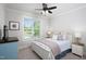Bedroom featuring a ceiling fan and a large window that provides natural light at 92 Cardinal Ridge Rd, Chapel Hill, NC 27516