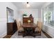 Formal dining room featuring classic wainscoting, elegant furnishings, and natural light at 92 Cardinal Ridge Rd, Chapel Hill, NC 27516