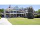 Three-story building with stone accents, multiple balconies, and lush landscaping at 92 Cardinal Ridge Rd, Chapel Hill, NC 27516