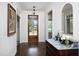 Elegant foyer with hardwood floors, sophisticated decor, and a glimpse into other rooms at 92 Cardinal Ridge Rd, Chapel Hill, NC 27516