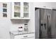 Kitchen with stainless steel refrigerator, granite countertops, and white cabinets at 92 Cardinal Ridge Rd, Chapel Hill, NC 27516