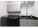 Laundry room featuring updated washer and dryer and utility sink with storage above at 92 Cardinal Ridge Rd, Chapel Hill, NC 27516