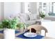 Bright living room featuring a comfortable gray couch, neutral decor, and ample natural light from a window at 92 Cardinal Ridge Rd, Chapel Hill, NC 27516