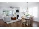 Open-concept living room with hardwood floors, fireplace, and natural light at 92 Cardinal Ridge Rd, Chapel Hill, NC 27516
