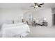 Spacious bedroom with comfortable seating, a ceiling fan, and natural light at 92 Cardinal Ridge Rd, Chapel Hill, NC 27516