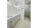 Modern bathroom with dual vanity, sleek cabinets, quartz countertops, and tiled walk-in shower at Lot 3260 Yorkshire Cir, Sanford, NC 27332