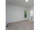 Bright and airy bedroom features plush carpet and an ensuite bathroom at Lot 3260 Yorkshire Cir, Sanford, NC 27332