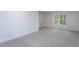 A modern bedroom with neutral carpet at Lot 3260 Yorkshire Cir, Sanford, NC 27332