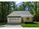 Charming home featuring an attached garage, well-manicured lawn, and inviting front entrance at Lot 3260 Yorkshire Cir, Sanford, NC 27332