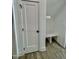 Hallway featuring a door, built-in bench and shelf in an alcove for seating and storage at Lot 3260 Yorkshire Cir, Sanford, NC 27332