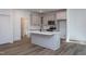 Beautiful kitchen featuring gray cabinets, stainless appliances, and a center island with a sink at Lot 3260 Yorkshire Cir, Sanford, NC 27332