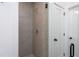 A modern, tiled shower with glass door and brushed metal hardware at Lot 3260 Yorkshire Cir, Sanford, NC 27332