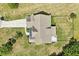 Aerial view of home showing manicured landscaping, lawn, and deck with a clear view of the rooftop at 10 Princeton Manor Dr, Youngsville, NC 27596