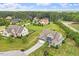 Stunning aerial view of a home nestled on a lush lot, showcasing its curb appeal and spacious surroundings at 10 Princeton Manor Dr, Youngsville, NC 27596