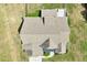 Overhead view of the home featuring a well manicured lawn, landscaping, and deck at 10 Princeton Manor Dr, Youngsville, NC 27596