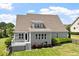 Charming home with a well-maintained yard, a deck, and mature landscaping providing a private and serene outdoor space at 10 Princeton Manor Dr, Youngsville, NC 27596
