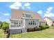 Well-maintained backyard featuring a deck and lush green lawn at 10 Princeton Manor Dr, Youngsville, NC 27596