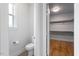 Well-lit bathroom featuring a toilet and an entrance to a spacious walk-in closet at 10 Princeton Manor Dr, Youngsville, NC 27596