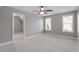 Bedroom featuring neutral walls, carpet flooring, a ceiling fan, and two windows offering natural light at 10 Princeton Manor Dr, Youngsville, NC 27596