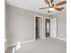 Bedroom featuring neutral walls, a ceiling fan, and doors leading to other rooms at 10 Princeton Manor Dr, Youngsville, NC 27596