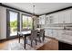 Bright breakfast nook with access to deck, adjacent to well-appointed kitchen at 10 Princeton Manor Dr, Youngsville, NC 27596