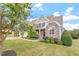 Charming two-story home with stone accents, mature landscaping, and inviting curb appeal at 10 Princeton Manor Dr, Youngsville, NC 27596
