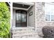 Charming front entrance featuring a stone facade and double doors at 10 Princeton Manor Dr, Youngsville, NC 27596