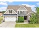 Beautiful two-story home with stone accents and a spacious two-car garage at 10 Princeton Manor Dr, Youngsville, NC 27596